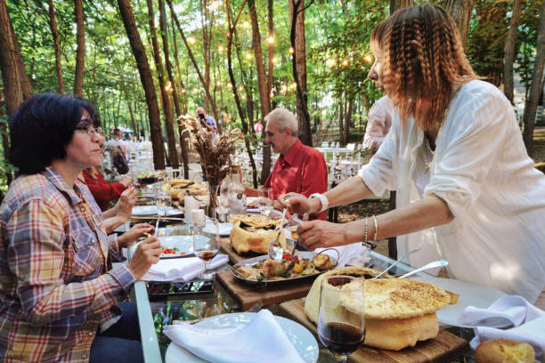 istock Mature couples eating outdoors 1269560541