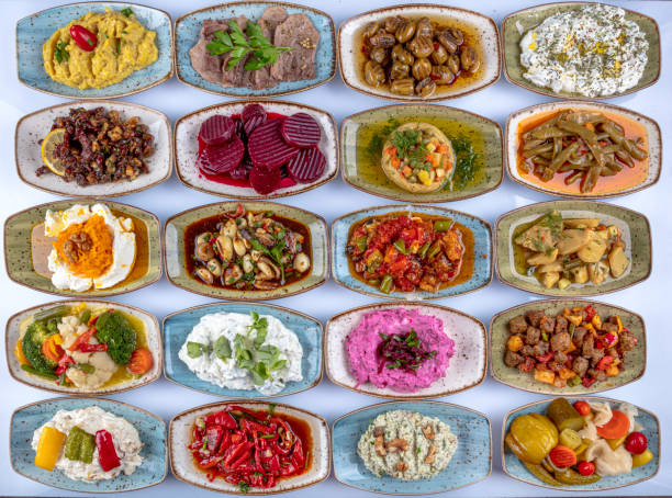 istock Traditional Turkish and Greek dinner meze table. Turkish Cuisine Cold Appetizers (appetizers with olive oil). Turkish appetizers in colorful plates. yogurt and various boiled herbs. 1269562437