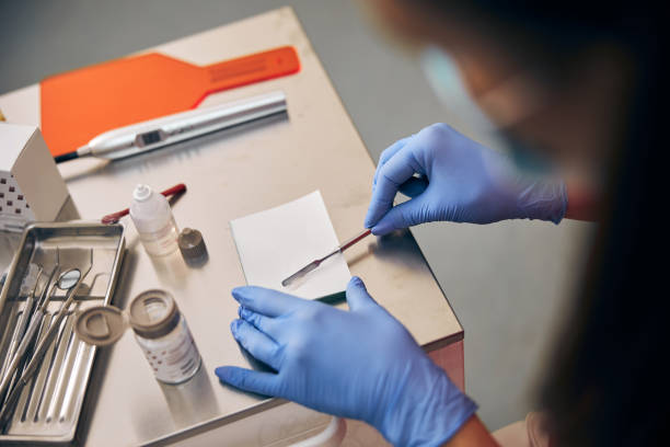 istock Professional orthodontist working with material for treating teeth 1269563101