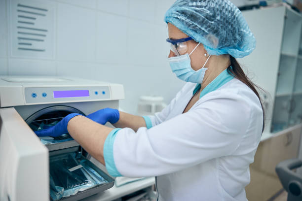 istock Assistant with sterile dentist tools in dentist office 1269564029