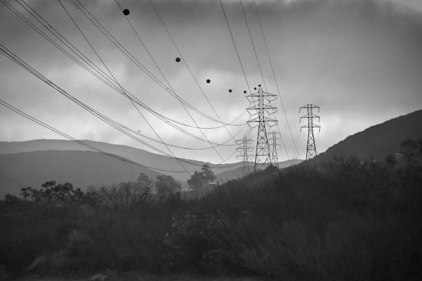 Hills, fog, silhouettes of power lines in southern California