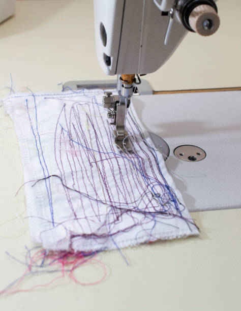 istock sewing machine, sewing disposable medical masks. virus protection. 1269569542