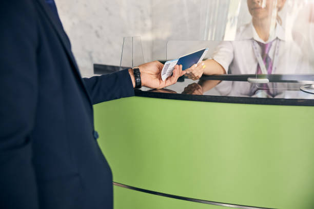 istock Traveler getting passport and flight tickets back after a check 1269570332