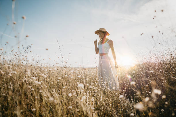 istock Beautiful woman in a meadow 1269572583