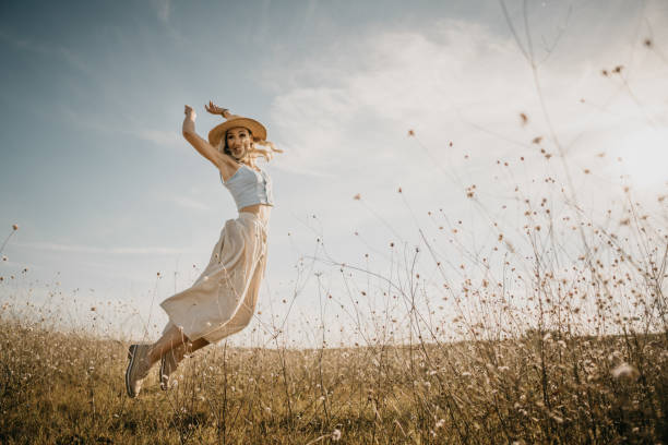 istock Beautiful woman in a meadow 1269573224