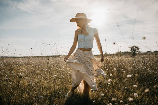 istock Beautiful woman in a meadow 1269573254