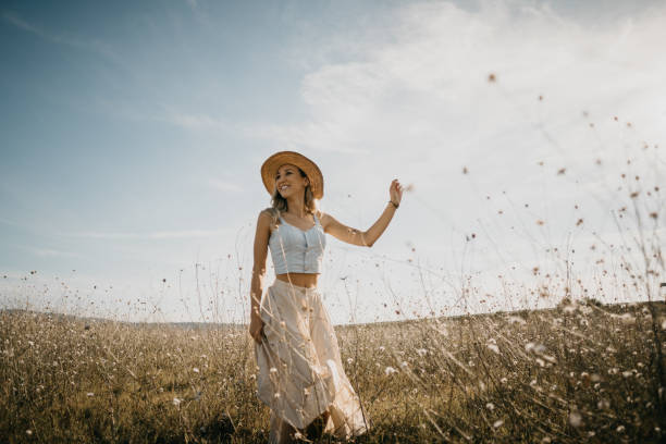 istock Beautiful woman in a meadow 1269573275