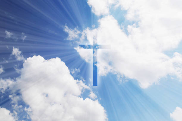 istock Christian cross appears bright in the sky 1269577172