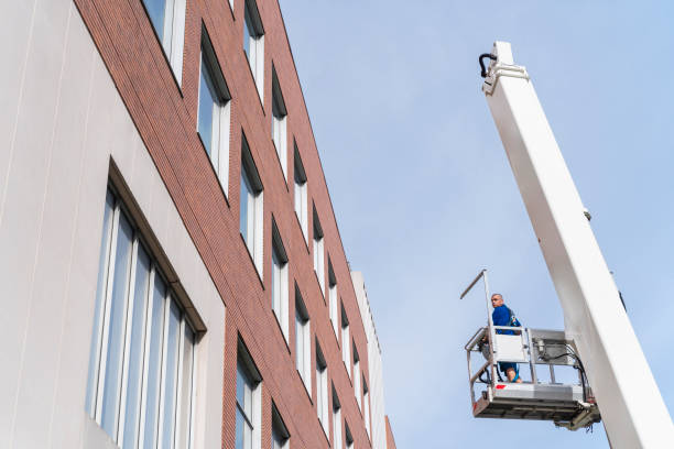 istock Lifting platform operator working on the street in Harlem, NYC 1269581617