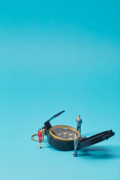 istock Miniature businessman and compass on blue background 1269584666
