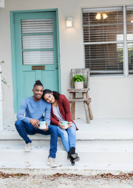 istock African-American couple hanging out, drinking coffee 1269586831