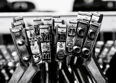 detail of an old printing press, in vintage colors