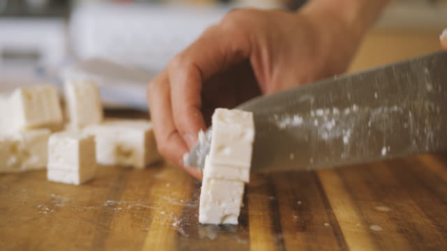 hand cut feta cheese into cubes