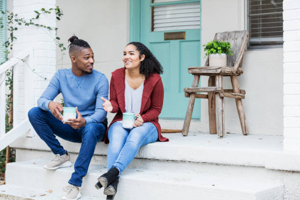 istock African-American couple hanging out, drinking coffee 1269592537