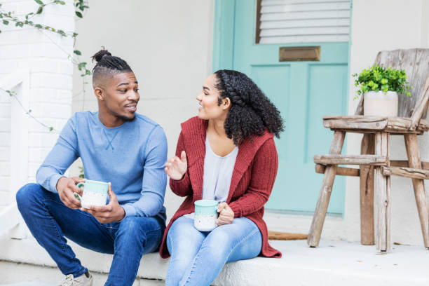 istock African-American couple hanging out, drinking coffee 1269592538