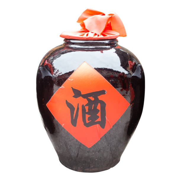 Jar of chinese white spirit,isolated on white background.The early Chinese, no glass bottles into China before, use this earthen jar filled with wine.The central character is the Chinese characters - 酒, that wine.