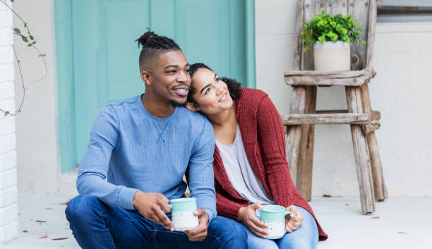 istock African-American couple hanging out, drinking coffee 1269595018
