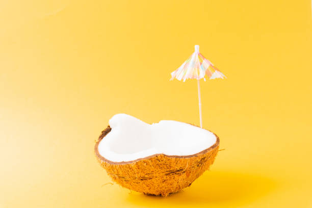 istock fresh coconut and sun umbrella 1269597125