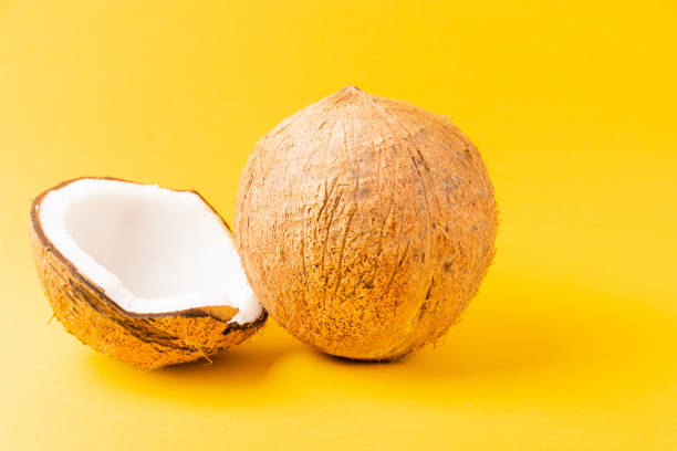 istock Fresh full coconut with half coconut 1269597127