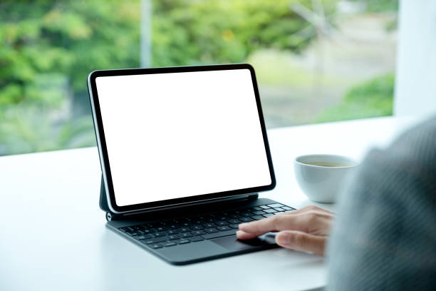 istock a woman touching on tablet touchpad with blank white desktop screen as computer pc in the office 1269608911