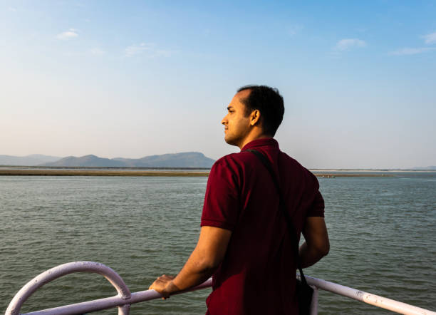 istock man posing at ship deck with river horizon at evening 1269617181