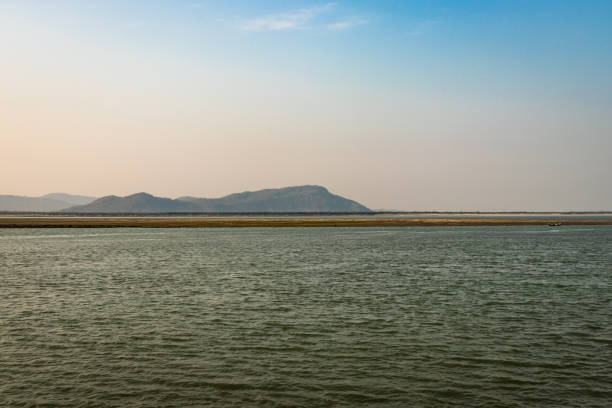 istock river island with mountain backdrop at dawn with bright blue sky 1269620174