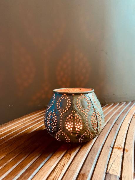 istock Candle in beautiful candlestick on wooden background 1269622425