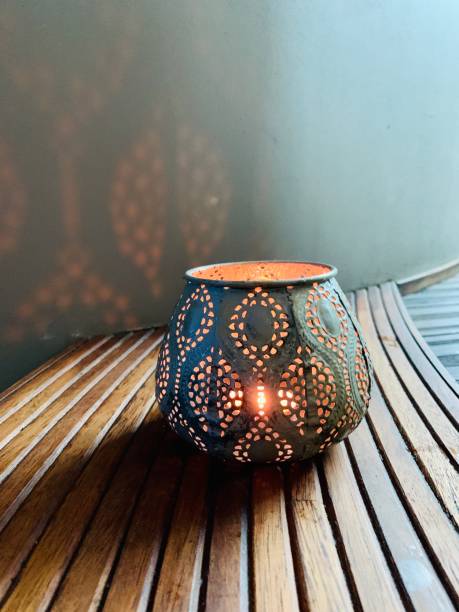 istock Candle in beautiful candlestick on wooden background 1269622490
