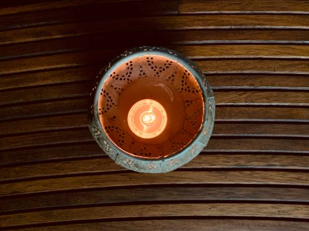 istock Candle in beautiful candlestick on wooden background  top view 1269622523