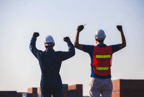 istock Silhouette of Business engineer man celebration success happiness on container box, Teamwork Concept 1269622649