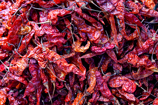 Pile of dried and smoked red hot peppers for sale, horizontal composition, Antigua Guatemala
