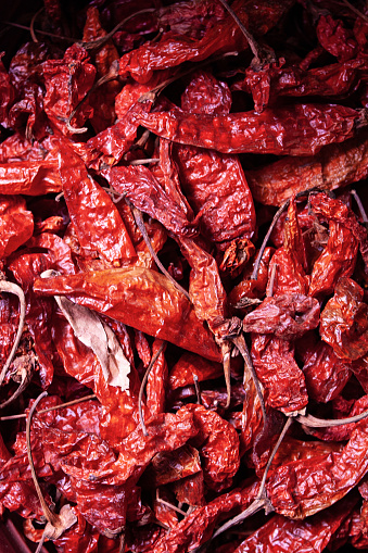 Red dried hot chilli pepper for sale at the market, vertical composition, Antigua Guatemala