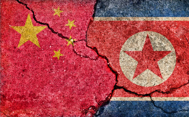 istock Grunge country flag illustration (cracked concrete background) / China vs North korea (Political or economic conflict) 1269631475