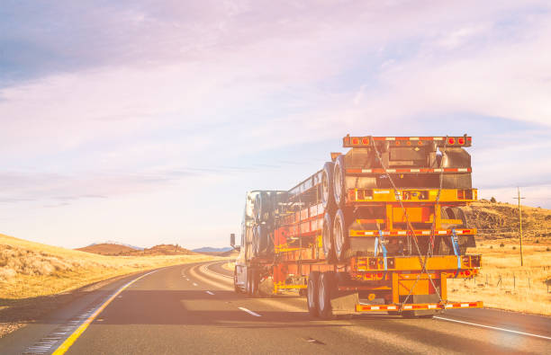 a semi truck traveling along the road
