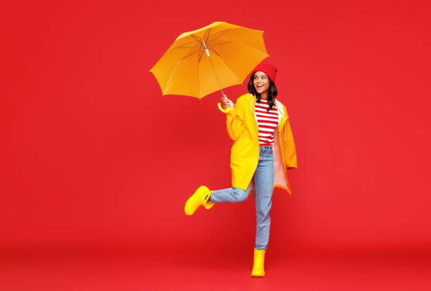 istock Happy ethnic female on rainy day 1269638480