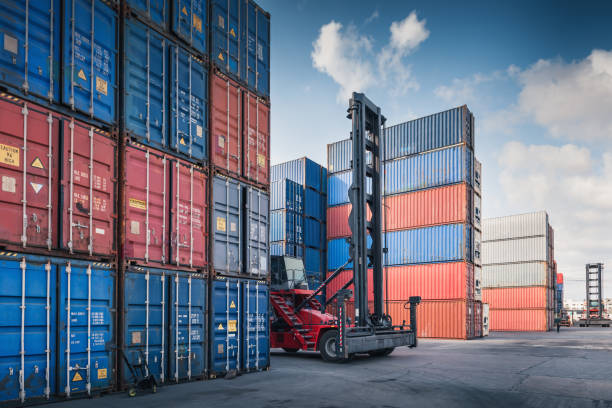 stack of containers cargo ship import/export in harbor port, cargo freight shipping of container logistics industry. nautical transport distribution yard, business commercial dock and transportation. - harbor cargo container commercial dock container imagens e fotografias de stock