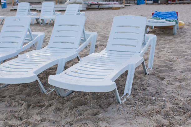 istock white sun loungers on the sandy beach 1269641259