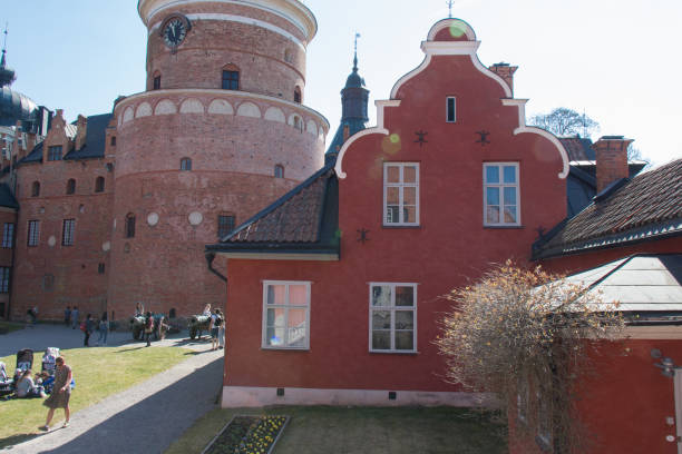 Interior courtyard of Gripsholm Castle in a sunny day, Mariefred, Sweden. Mariefred, Sweden - April 20 2019: the view of tourists in the interior courtyard of Gripsholm Castle on April 20 2019 in Mariefred, Sweden. mariefred stock pictures, royalty-free photos & images