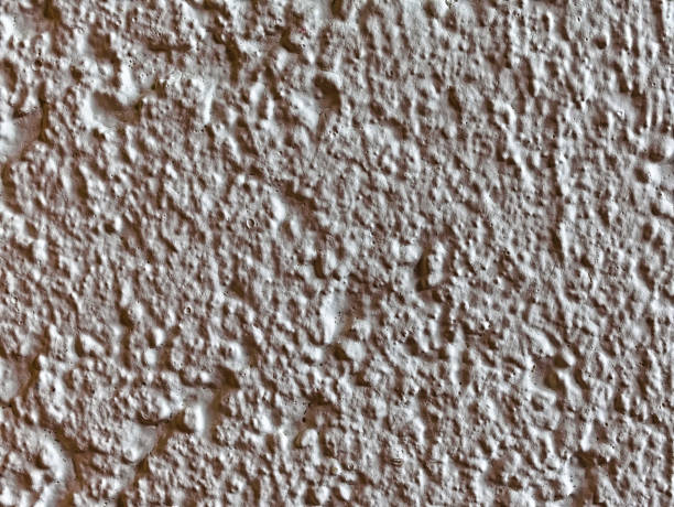 istock Close-up of a white wall with textured plaster in an apartment 1269646996