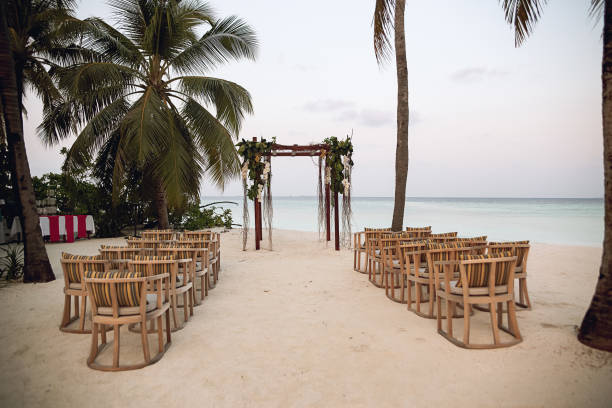 istock beach wedding set up, tropical outdoor wedding reception, wedding arch 1269648084