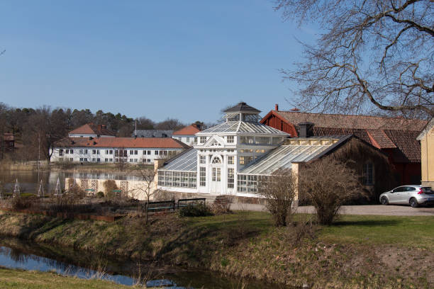 Orangery building at Gripsholm Castle territory, Mariefred, Sweden. Mariefred, Sweden - April 20 2019: the view of white building of orangery at Gripsholm Castle territory on April 20 2019 in Mariefred, Sweden. mariefred stock pictures, royalty-free photos & images