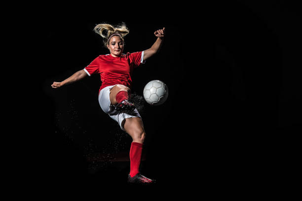 istock Female soccer player hitting a volley 1269652767