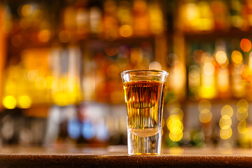 Toast with cognac or brandy with vodka or liqueur is on the bar.