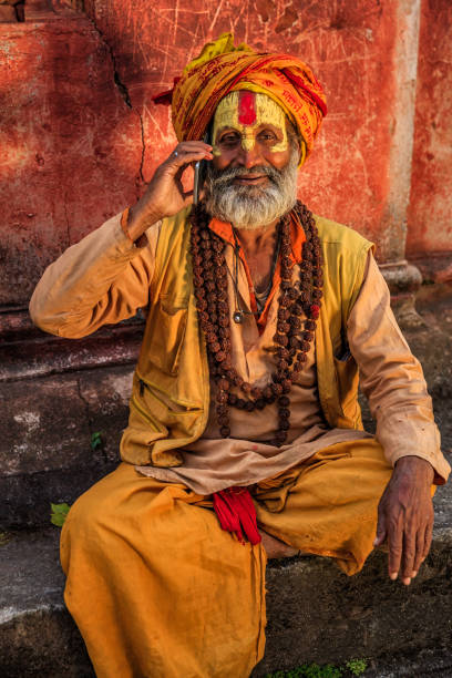 istock Sadhu - indian holyman using mobile phone 1269655388