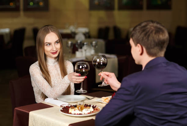 istock Couple toasting wineglasses in a luxury restaurant 1269656232