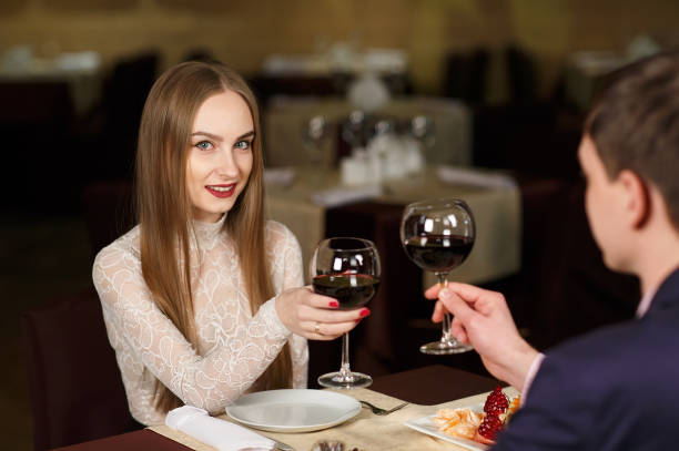 istock Couple toasting wineglasses in a luxury restaurant 1269656245