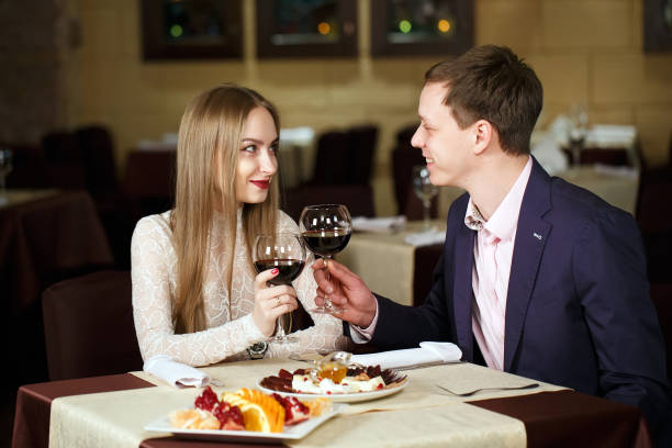 istock Couple toasting wineglasses in a luxury restaurant. 1269656372