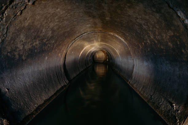 istock Industrial wastewater and urban sewage flowing through round sewer pipe 1269658933