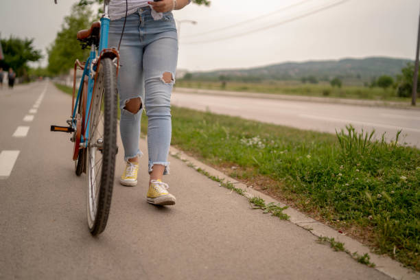 istock Young beautiful woman on a vintage bicycle. 1269659707