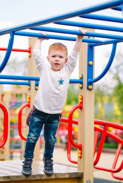 istock Little boy playing on the playground outdoors. 1269659782
